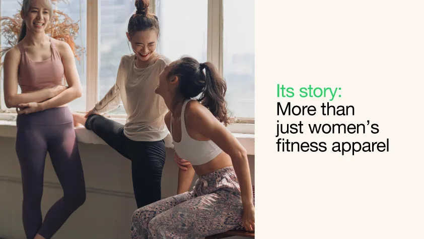 Three women laughing before workout class next to text that reads its story: more than just women's fitness apparel