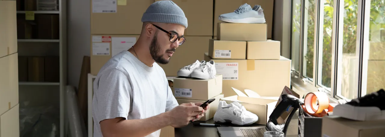 Person putting together online shoe orders to send out