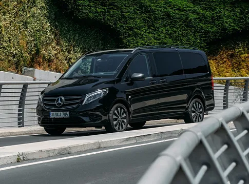 a black mercedes-benz on the road