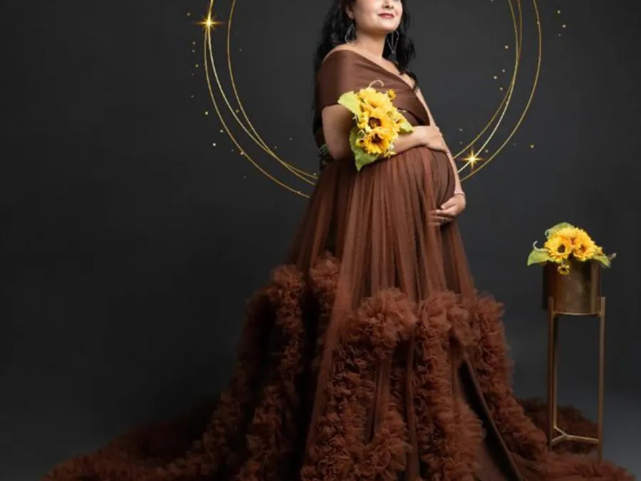 A pregnant woman in an elegant brown dress