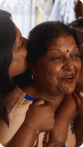 mother and daughter smiling showing they are happy to be able to connect on whatsapp
