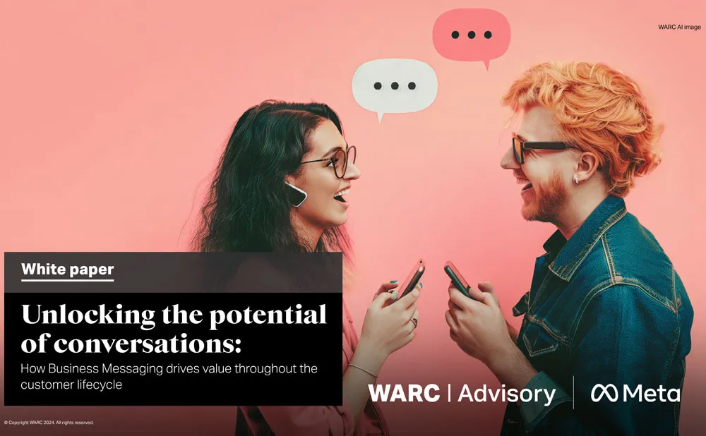 A man and a woman talking to each other while holding their phones