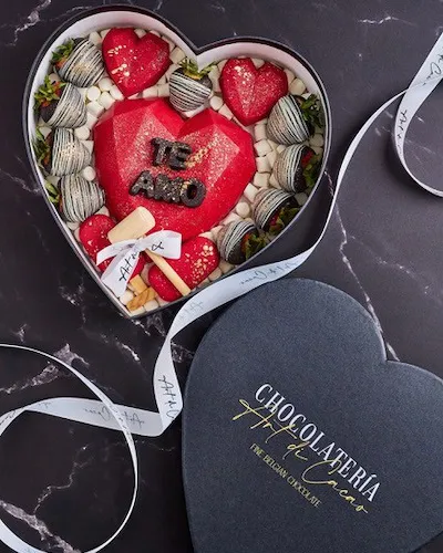 Chocolates in a dark heart shaped box