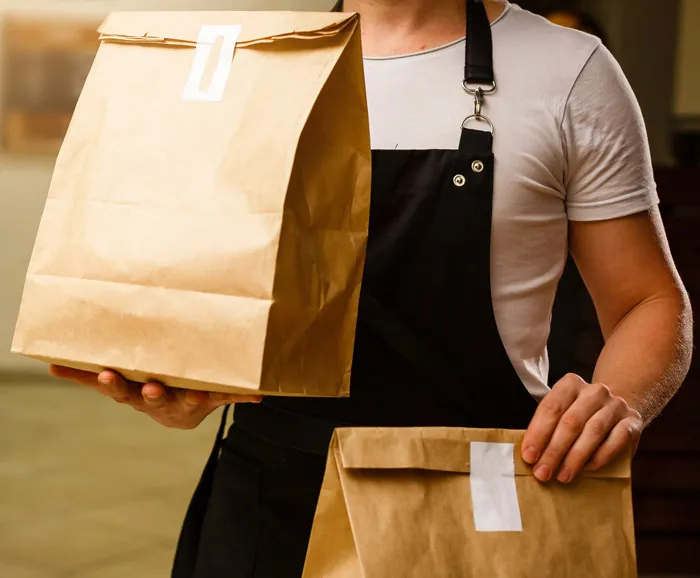 Person carrying delivery bags