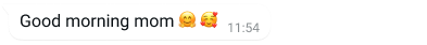 Exemple de bombolla de text a WhatsApp on es llegeix "Good morning mom" i un emoji.