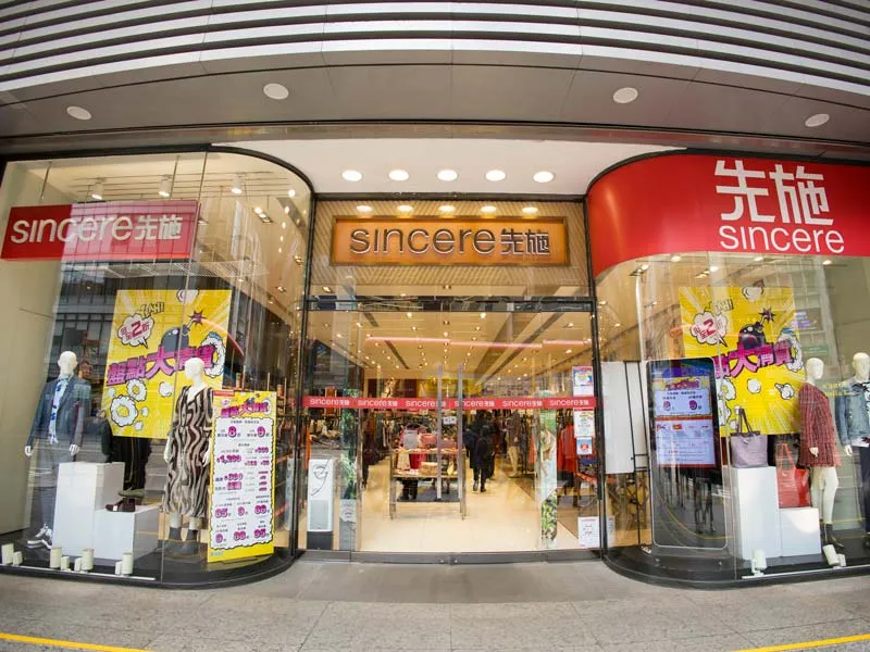 An image of the sincere company storefront all glass windows displaying clothing and merchandise
