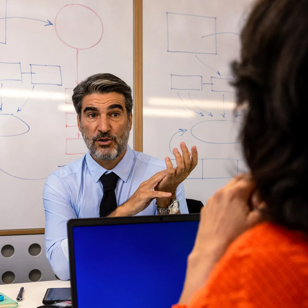 Team meeting at an office discussing business messaging measurement capabilities