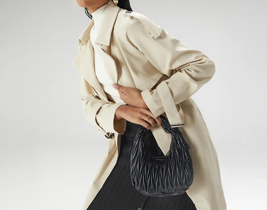 A woman dressed in clothes from Styli