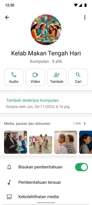 Skrin telefon pintar menunjukkan sembang kumpulan bernama "Kelab Makan Tengah Hari" seramai 5 ahli, butang untuk panggilan dan carian, serta pemberitahuan dibisukan.